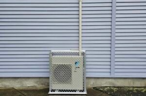 Daikin outdoor heat pump unit in cage