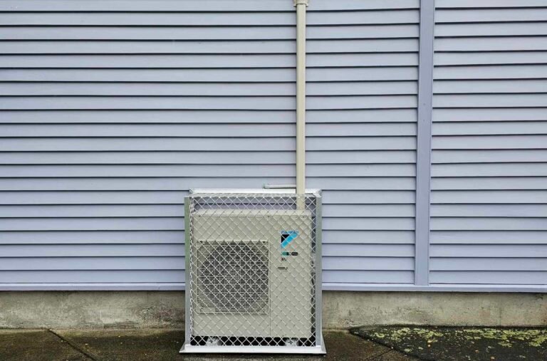 Daikin outdoor heat pump unit in cage