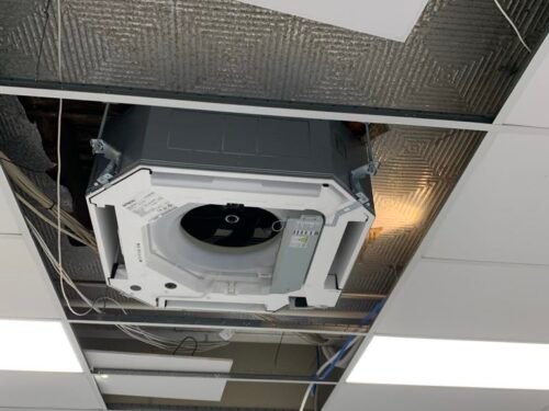Commercial heat pump cassette unit installation image in the production area