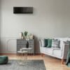 Stylish emerald green and grey living room interior design with Mitsubishi Electric Designer EF Series