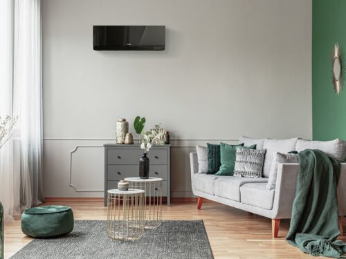 Stylish emerald green and grey living room interior design with Mitsubishi Electric Designer EF Series